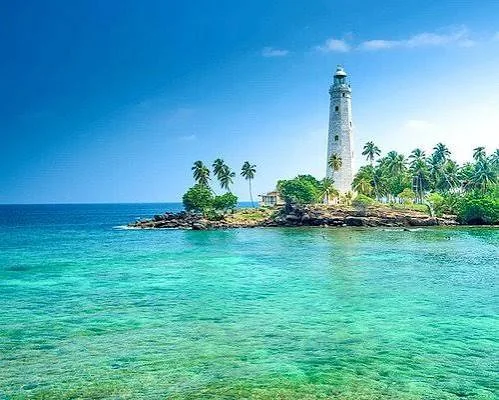 Lighthouse and turquoise sea near Dickwella