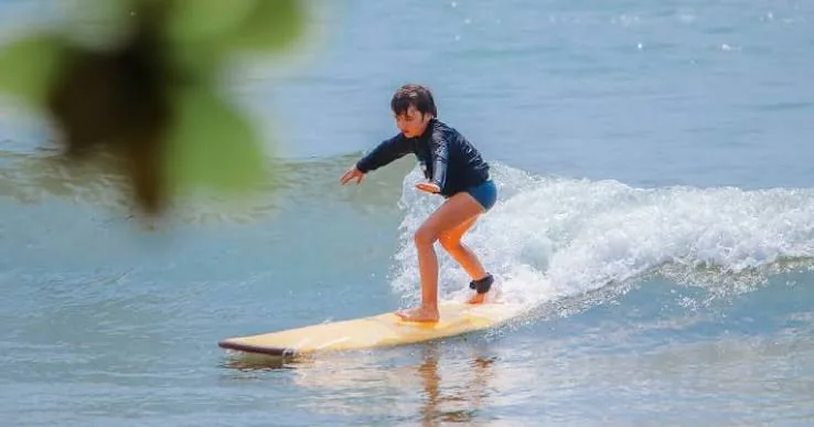 Beginner surfing practice during a lesson in Sri Lanka